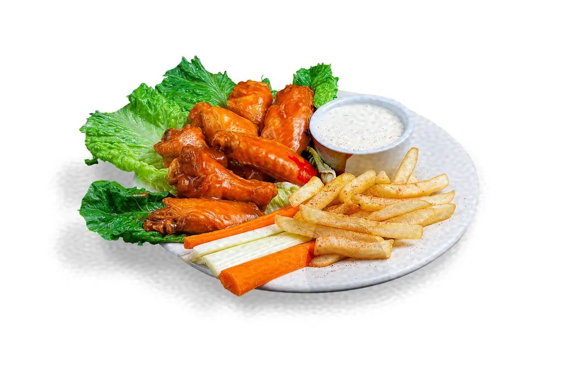Chicken wings with fries, carrots and celery